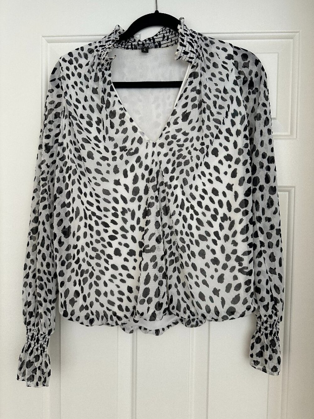Express black and white animal print crossover blouse
